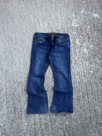 Vintage Y2K/Grunge Low-Rise Flared Streetwear Society Jeans (W26)