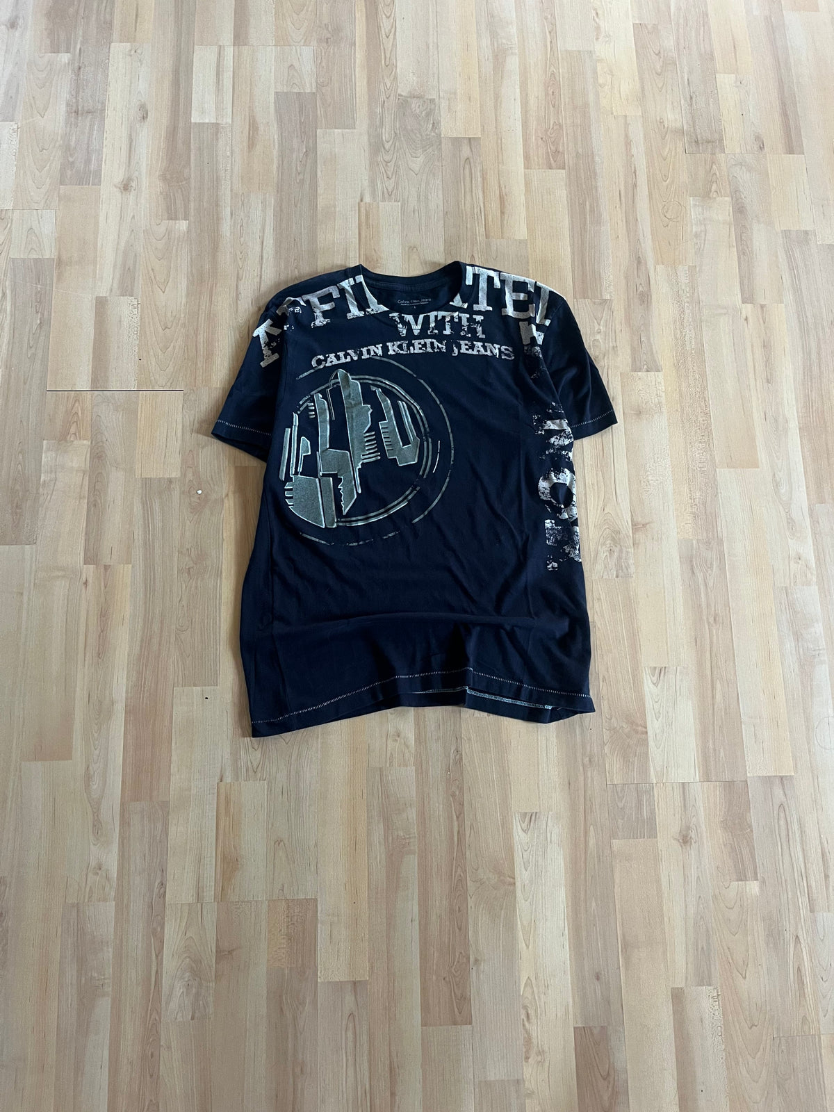 00s Black Single Stitch Calvin Klein Jeans Silver Spellout Graphic T-Shirt